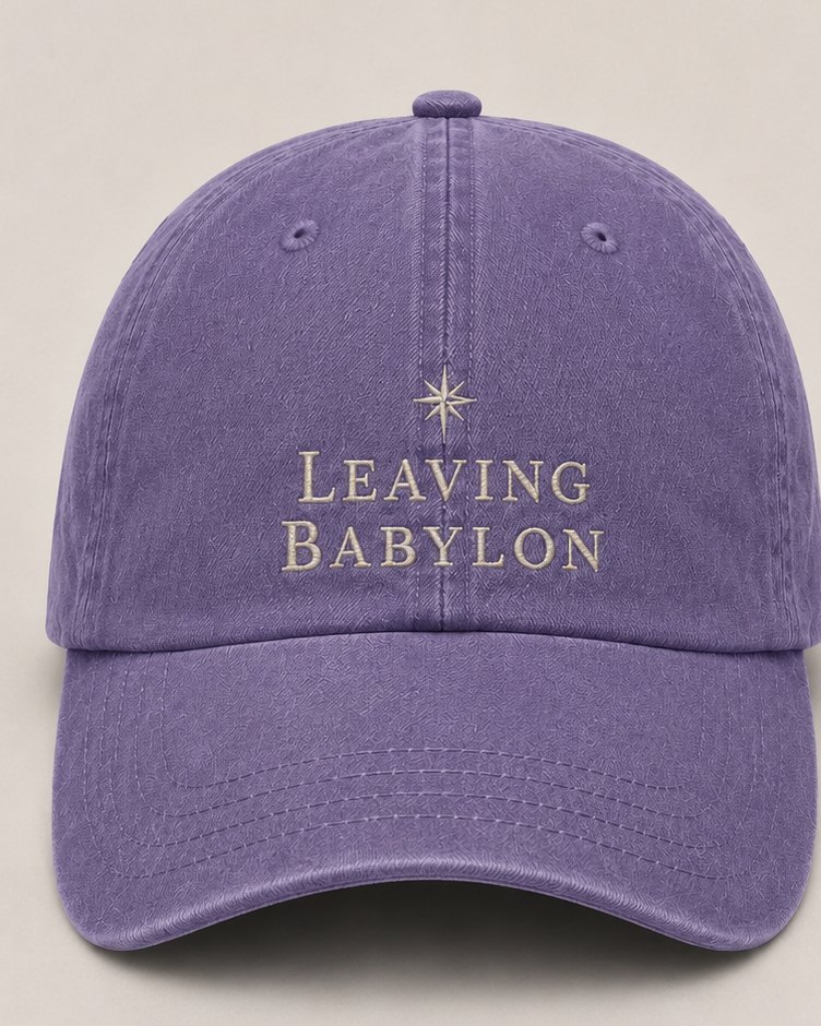 Leaving Babylon Dad Cap, front: a compass star over Leaving Babylon in cream thread