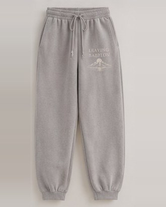Zion Finder Joggers laid flat, Leaving Babylon and mountains on the thigh